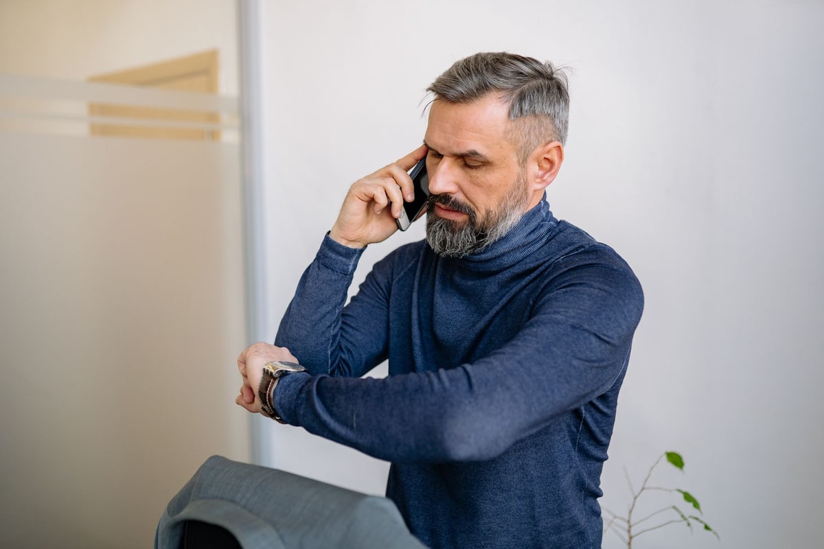 Customer using a phone to confirm or reschedule an appointment