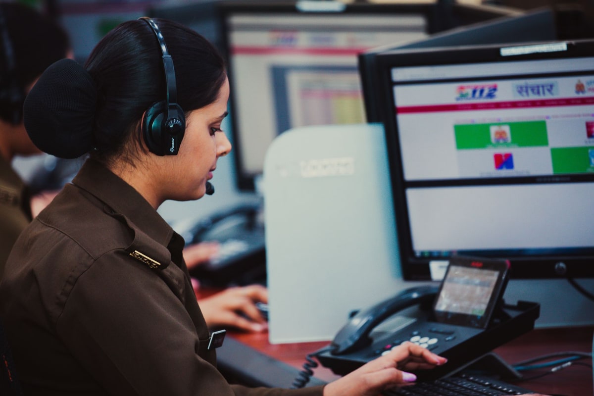 Service dispatcher reviewing after-hours lead coverage on a laptop