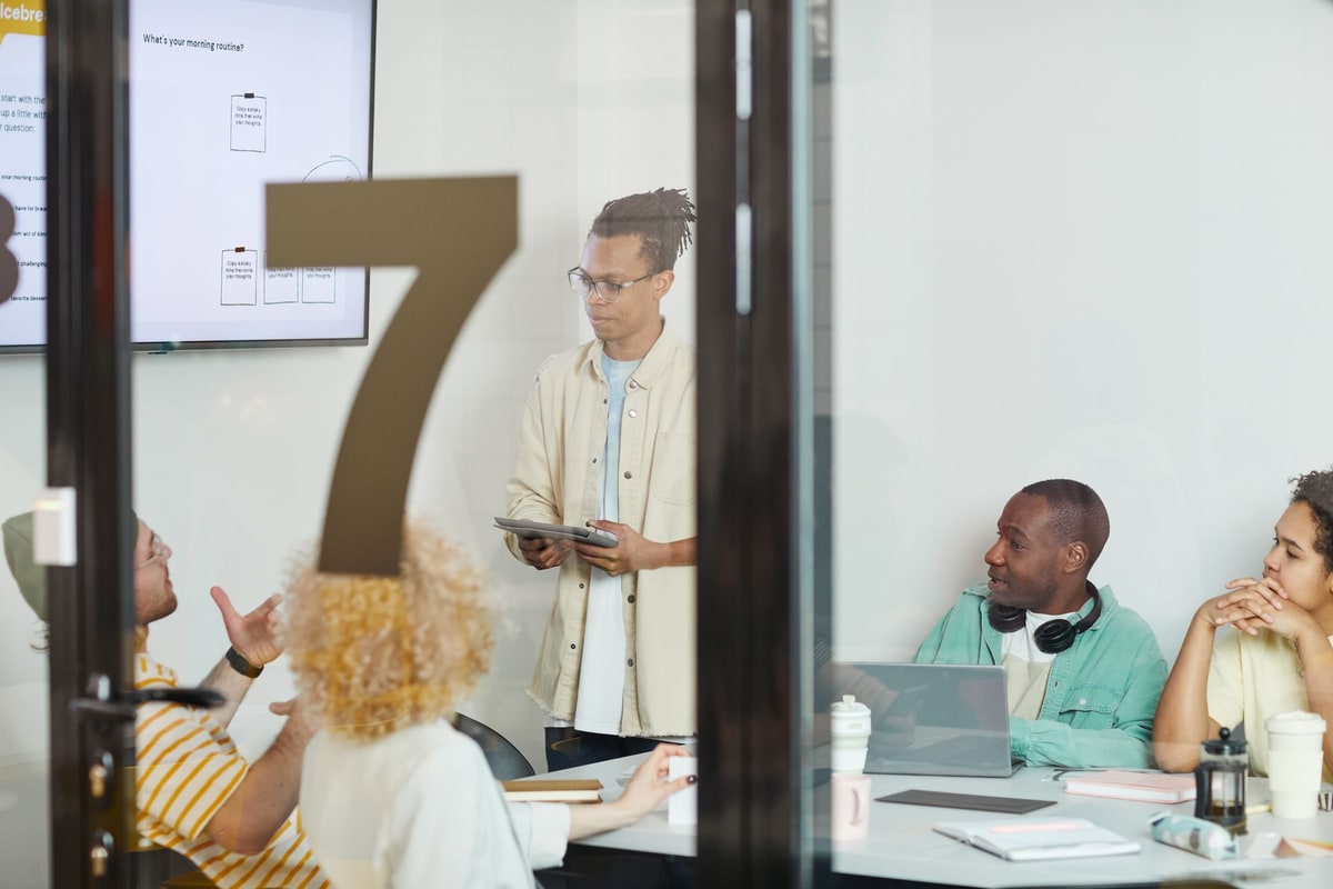 CRM team meeting around customer records