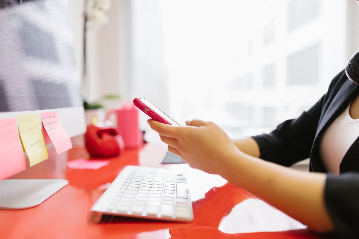 Business owner checking call volume on a phone at a desk