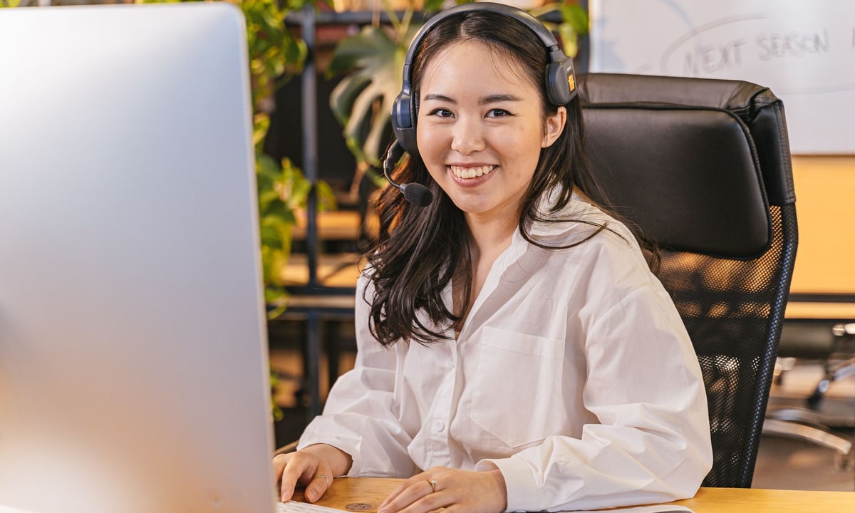 Receptionist with a headset answering a business call