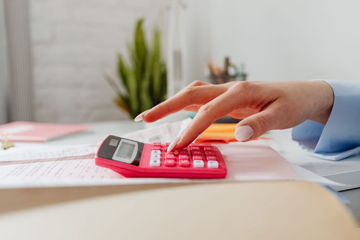Business owner reviewing an overdue invoice at a desk