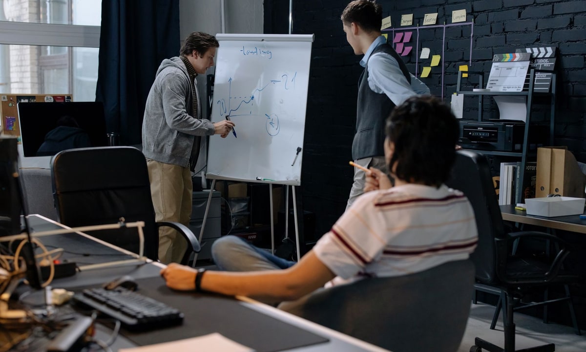 Operations team comparing workflow diagrams and automation platforms