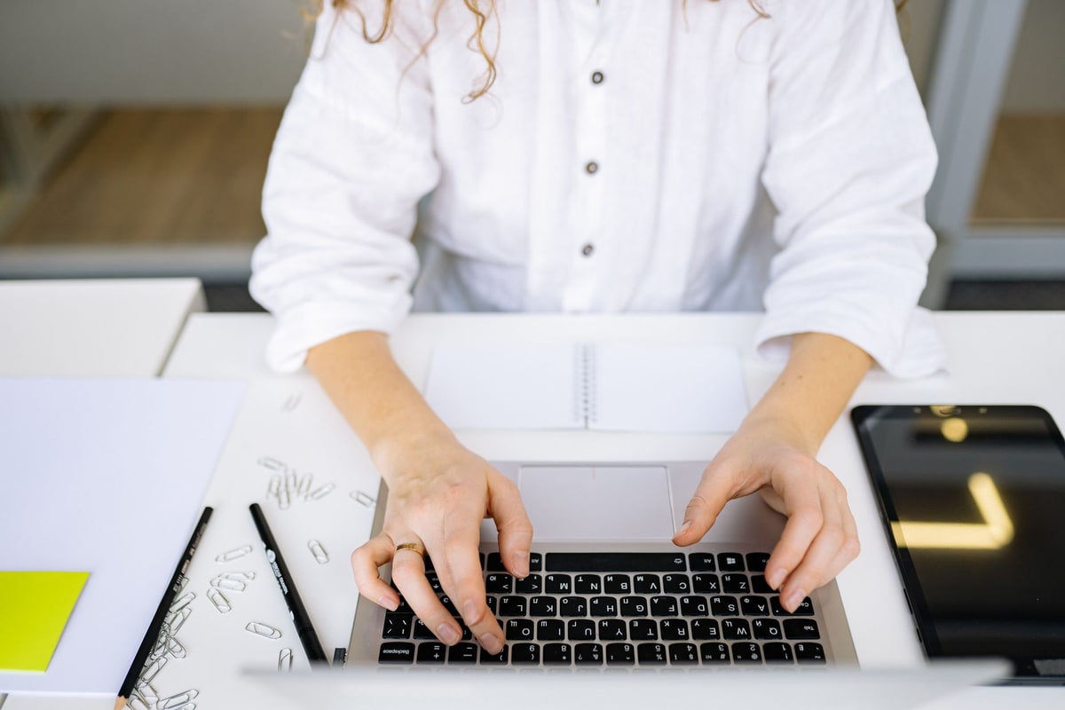 Salesperson comparing automation costs on a laptop